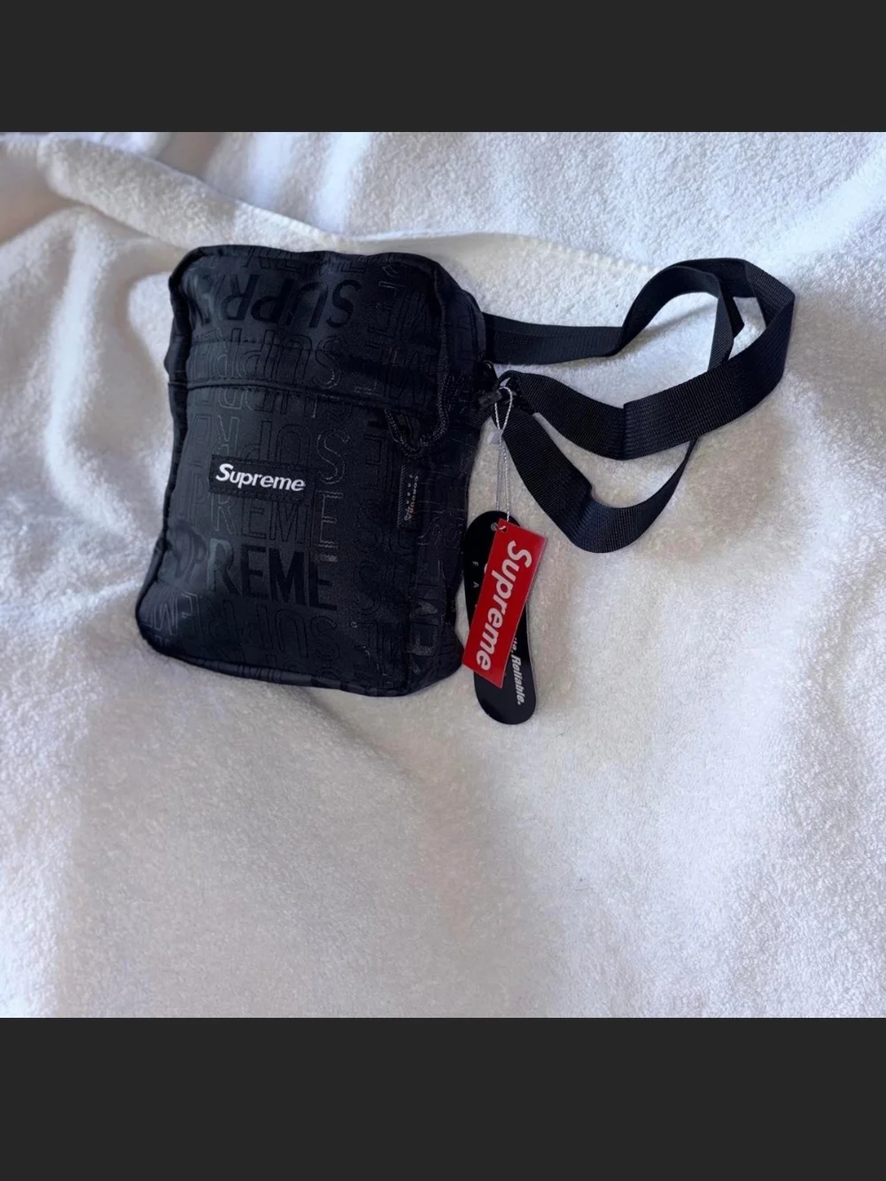 Supreme Black Embossed Logo Shoulder Bag with Red Tag
